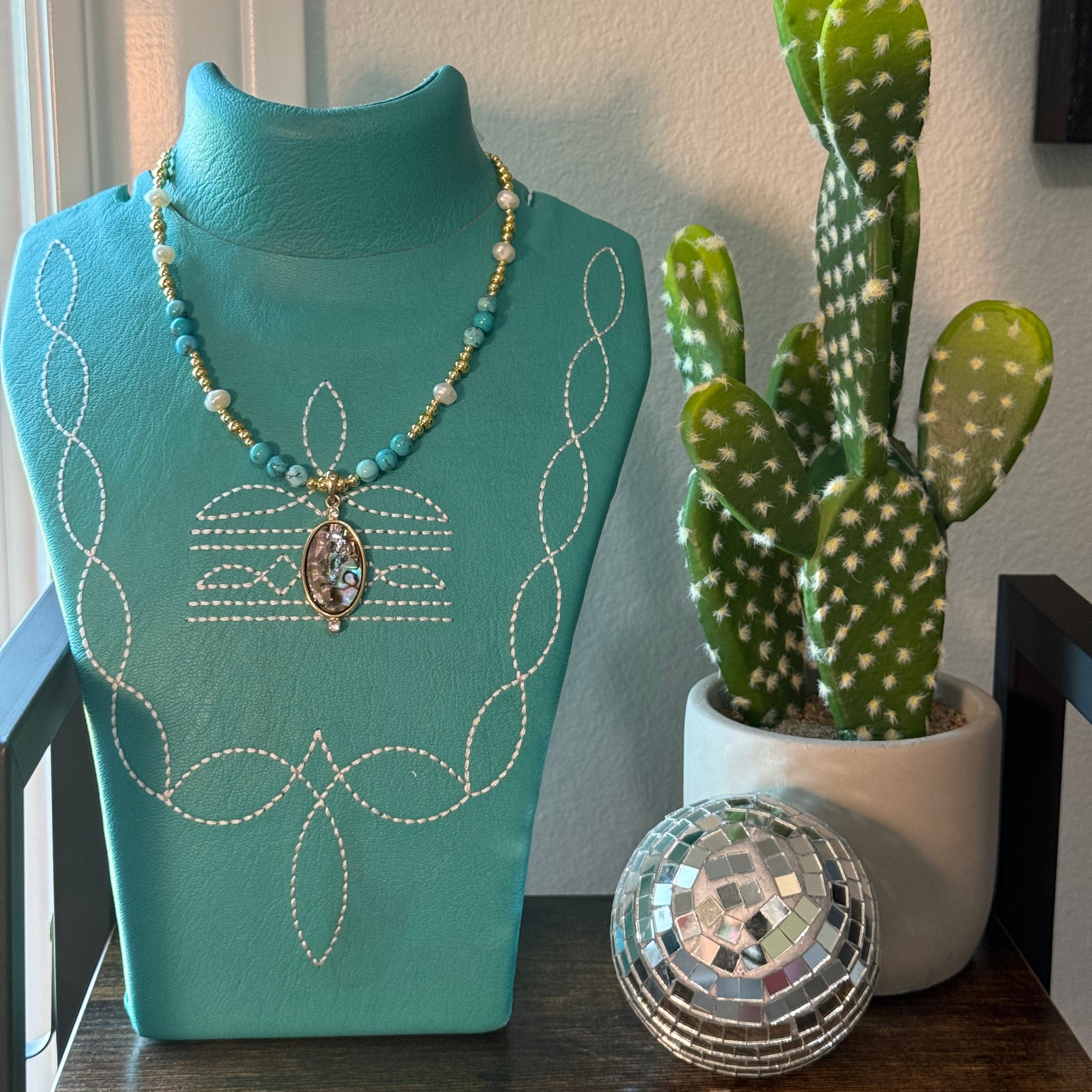 Gold and turquoise statement